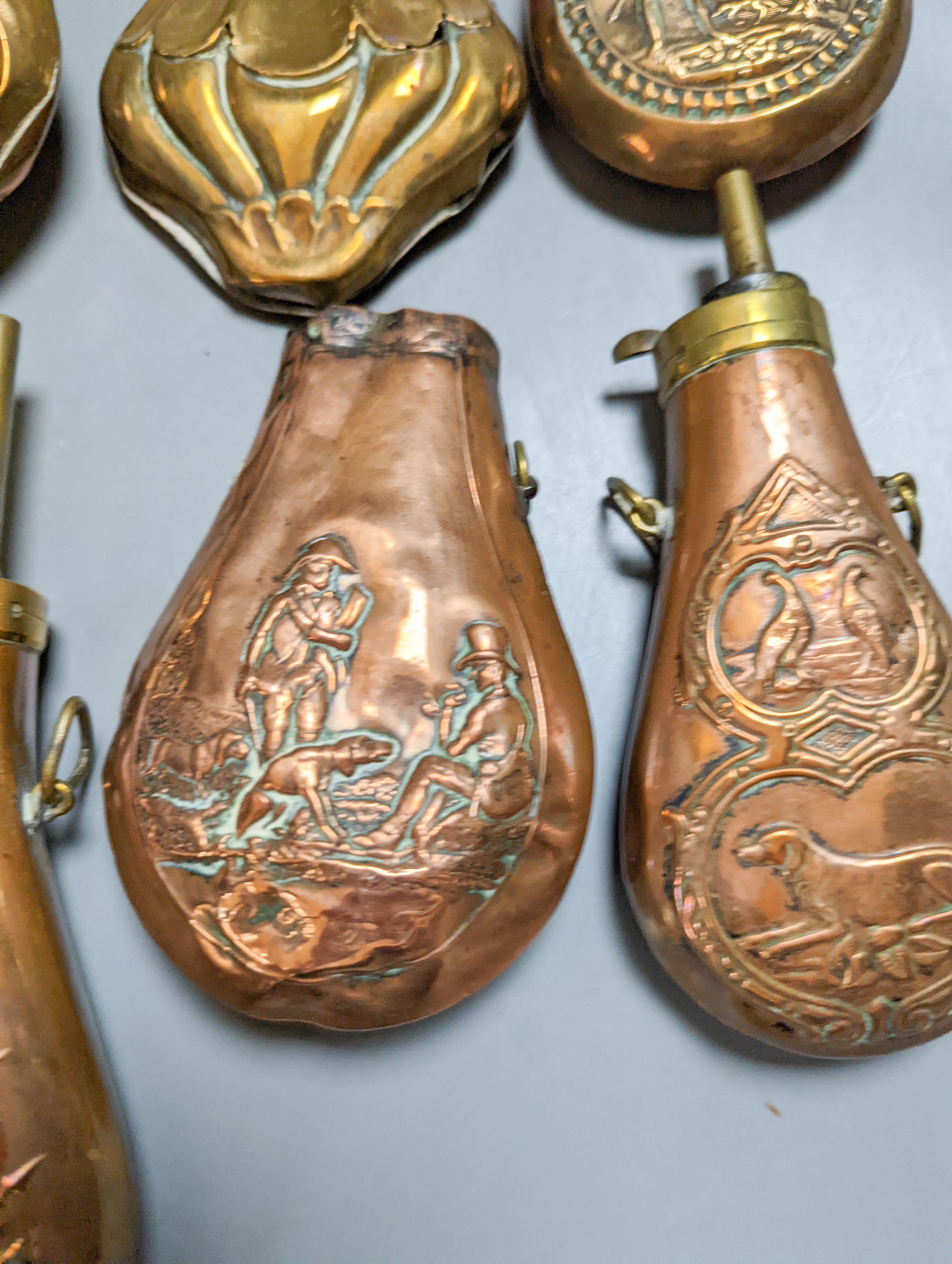 Eight assorted 19th century copper shot flasks